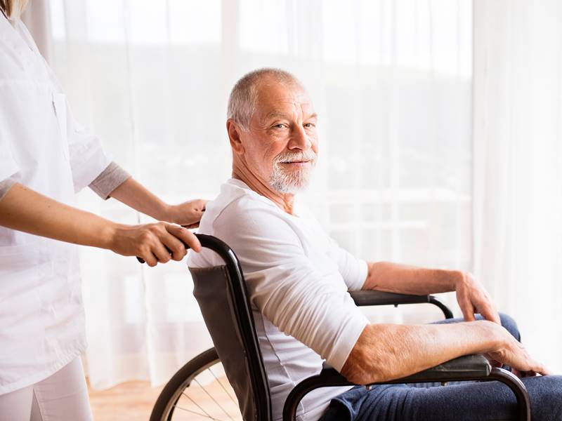 Caregiver helping senior